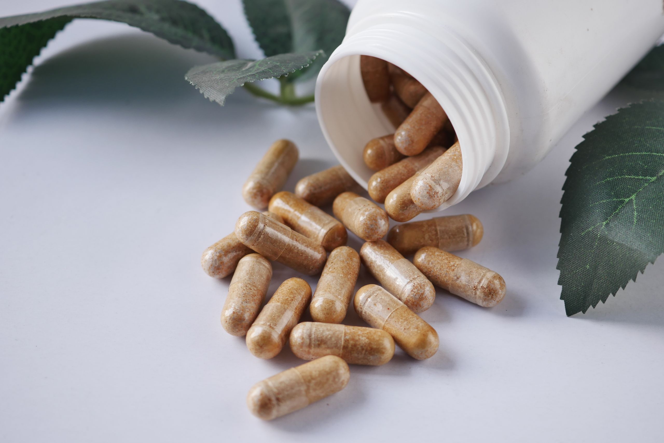 Close-up of a variety of nutritional supplements, vitamins, and probiotics.